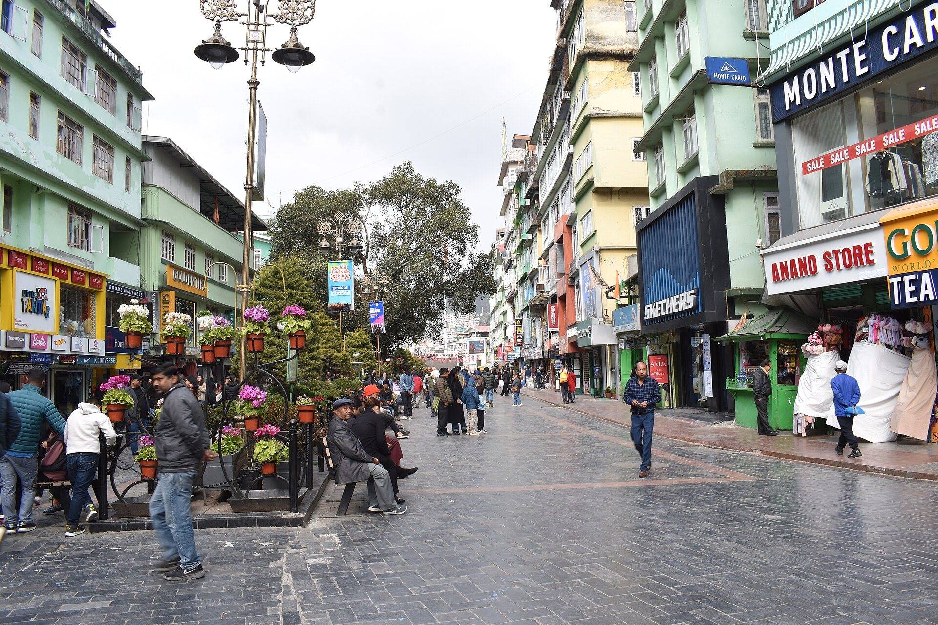 People walking along MG Marg, the pedestrian main street of Gangtok, lined with shops