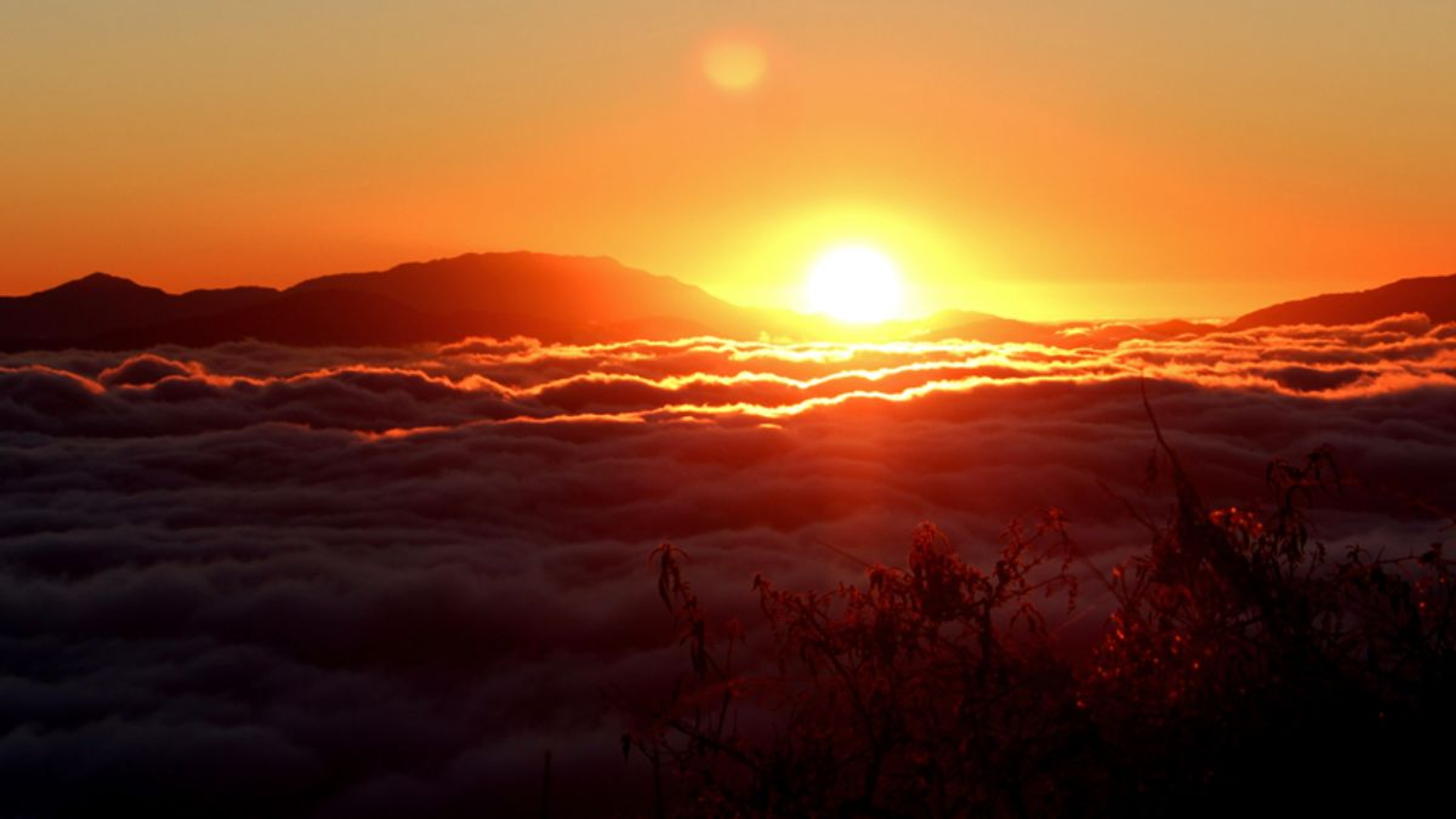 Golden sunrise over the Kanchenjunga peaks from Rayong Sunrise Viewpoint Ravangla.