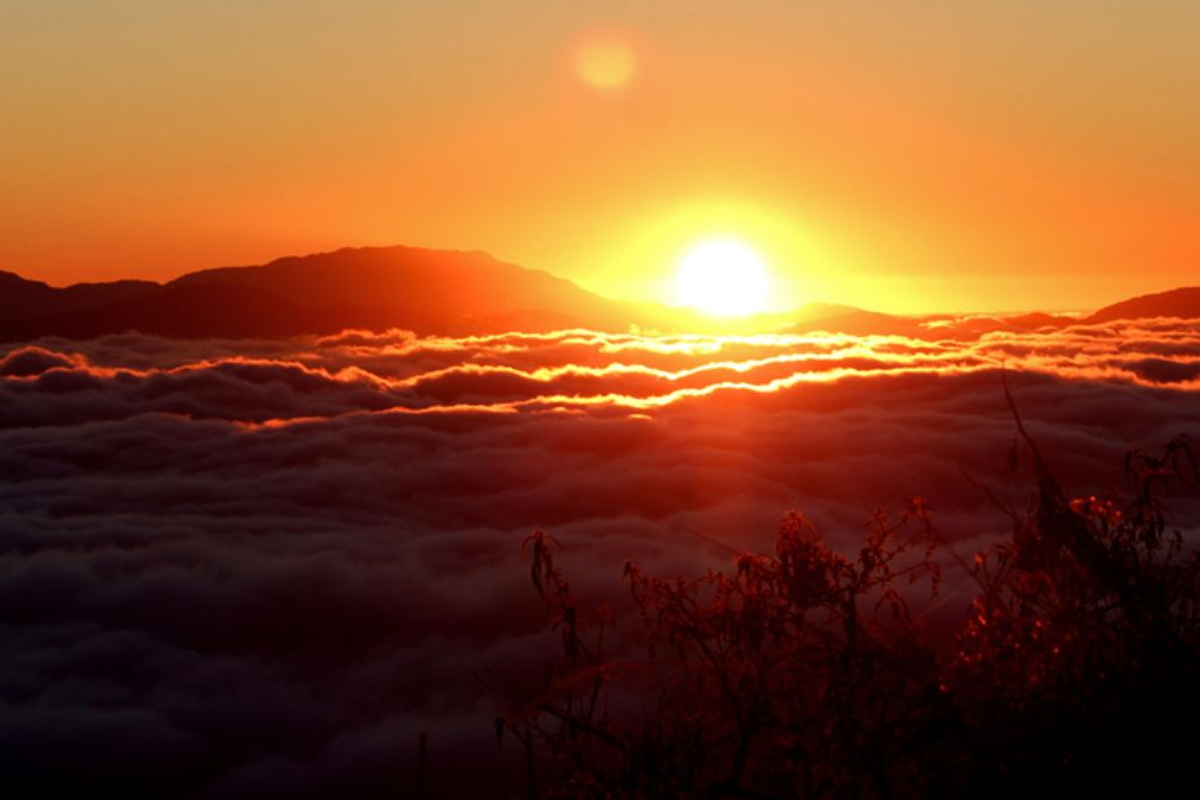 Golden sunrise over the Kanchenjunga peaks from Rayong Sunrise Viewpoint Ravangla.