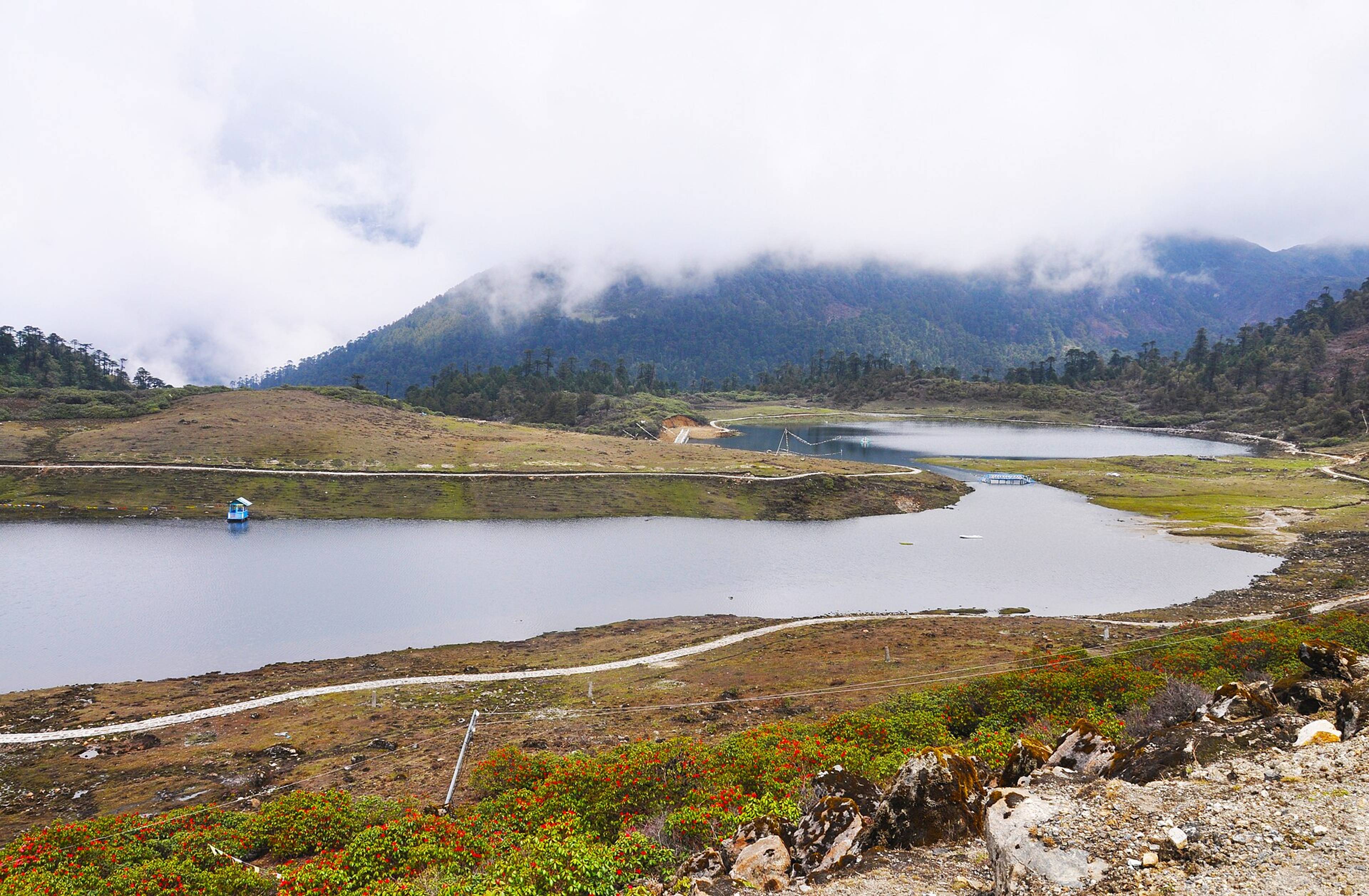 PT Tso lake surrounded by rocky hills on the road above Tawang
