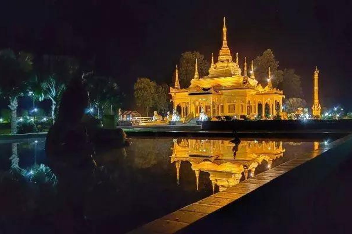 The stunning Golden Pagoda (Kongmu Kham) in Namsai, Arunachal Pradesh, illuminated at night.
