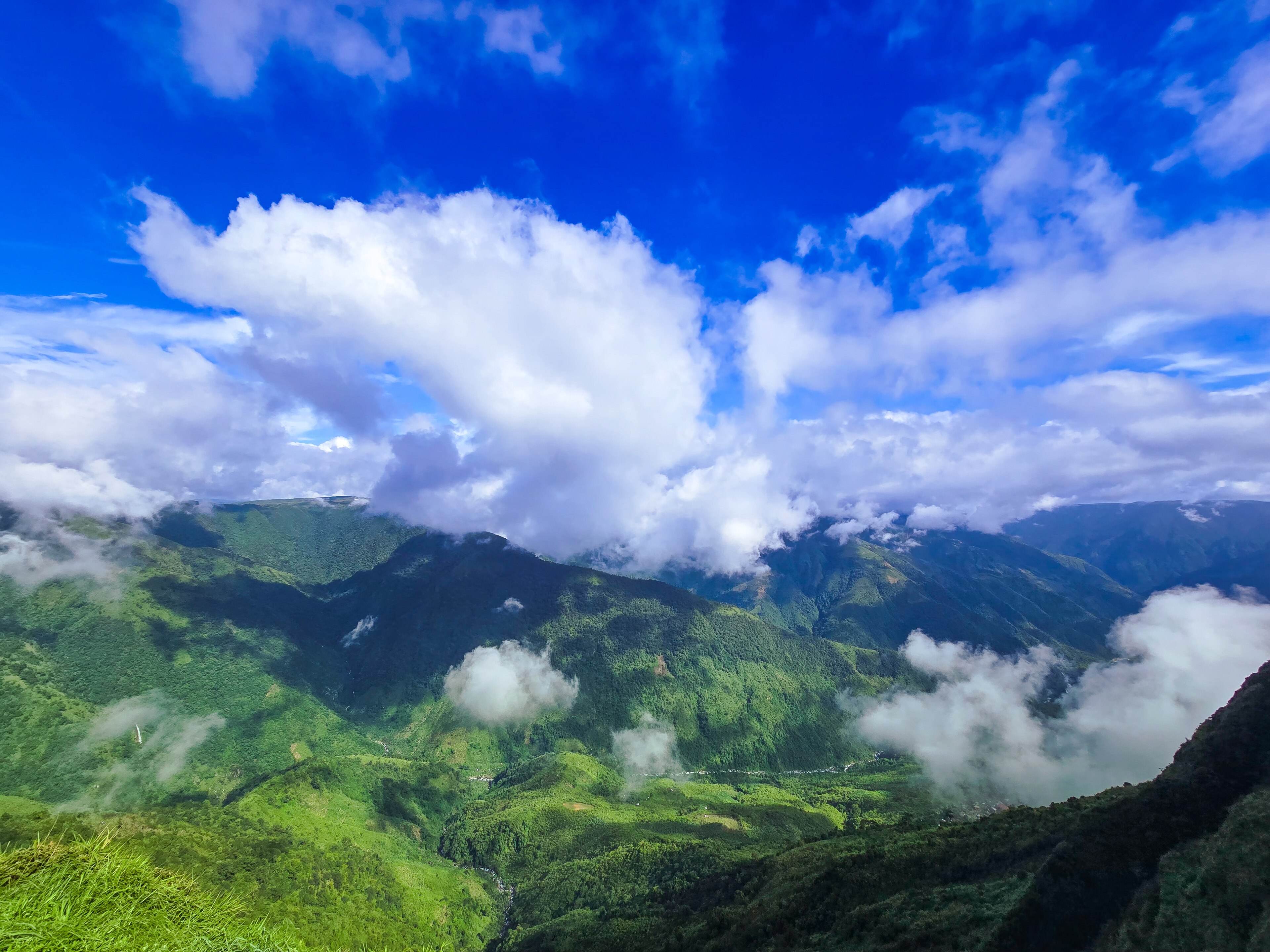 Clouds over the green valleys below Laitlum, near Shillong