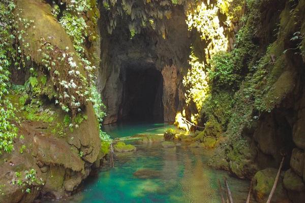 Entrance of Krem Chympe cave in Meghalaya with rocky formations