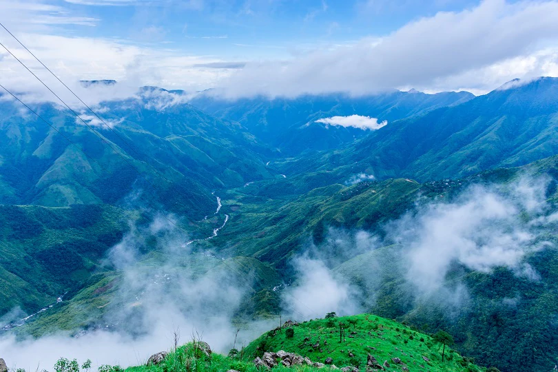 Laitlum Canyon Shillong Meghalaya — dramatic misty gorges and layered green valleys in the East Khasi Hills at sunrise