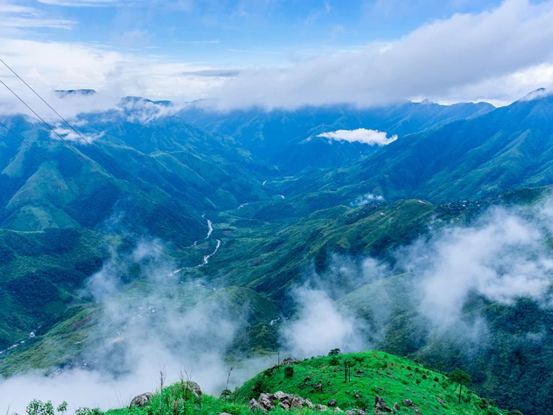 Laitlum Canyon Shillong Meghalaya — dramatic misty gorges and layered green valleys in the East Khasi Hills at sunrise