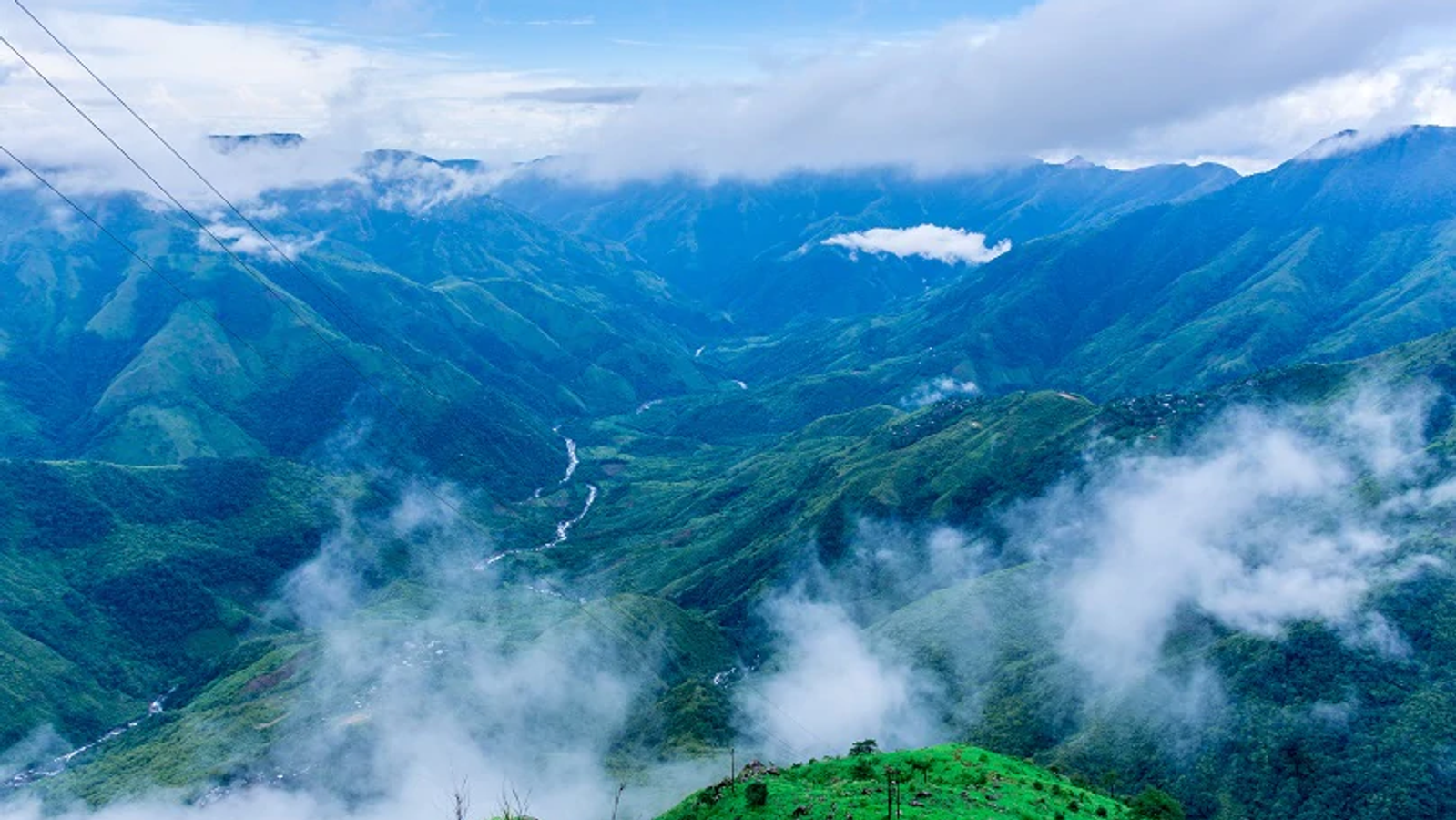 Laitlum Canyon Shillong Meghalaya — dramatic misty gorges and layered green valleys in the East Khasi Hills at sunrise