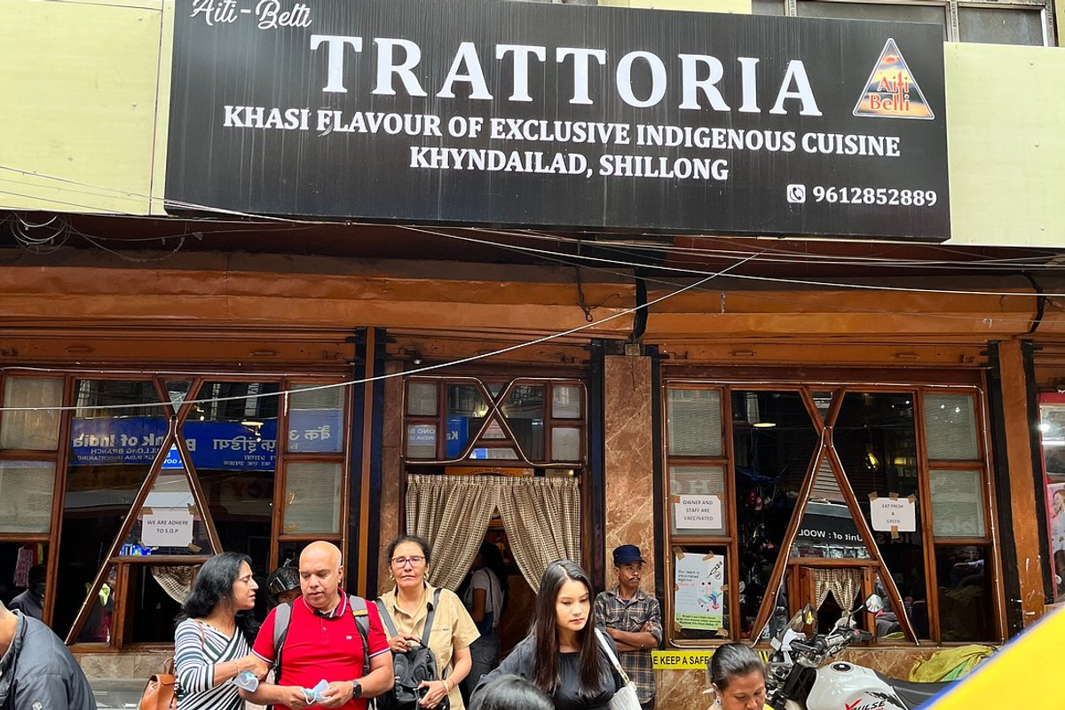 Traditional Khasi meal of Jadoh and Doh Neiiong served on a plate inside the cozy Trattoria restaurant in Police Bazar Shillong.