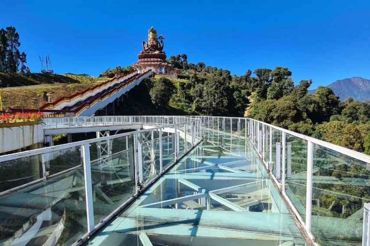 The glass skywalk in Pelling, West Sikkim, overlooking the Teesta river valley and distant Himalayan ranges.