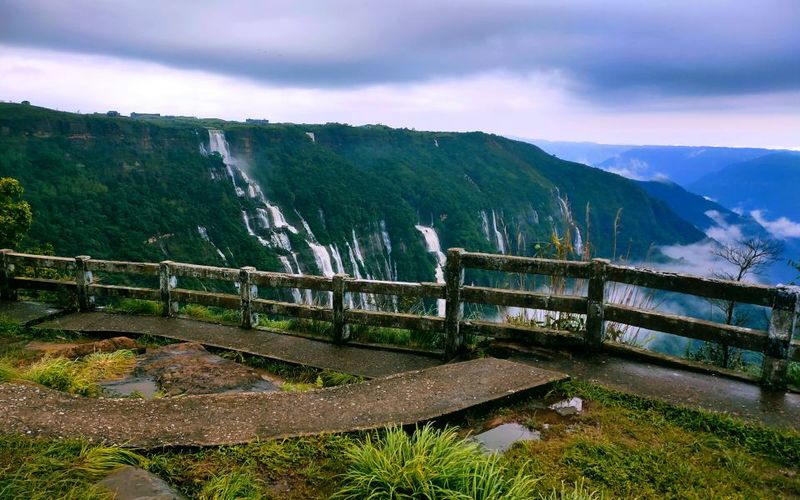 Panoramic view of cherrapunji waterfalls and lush green hills in meghalaya