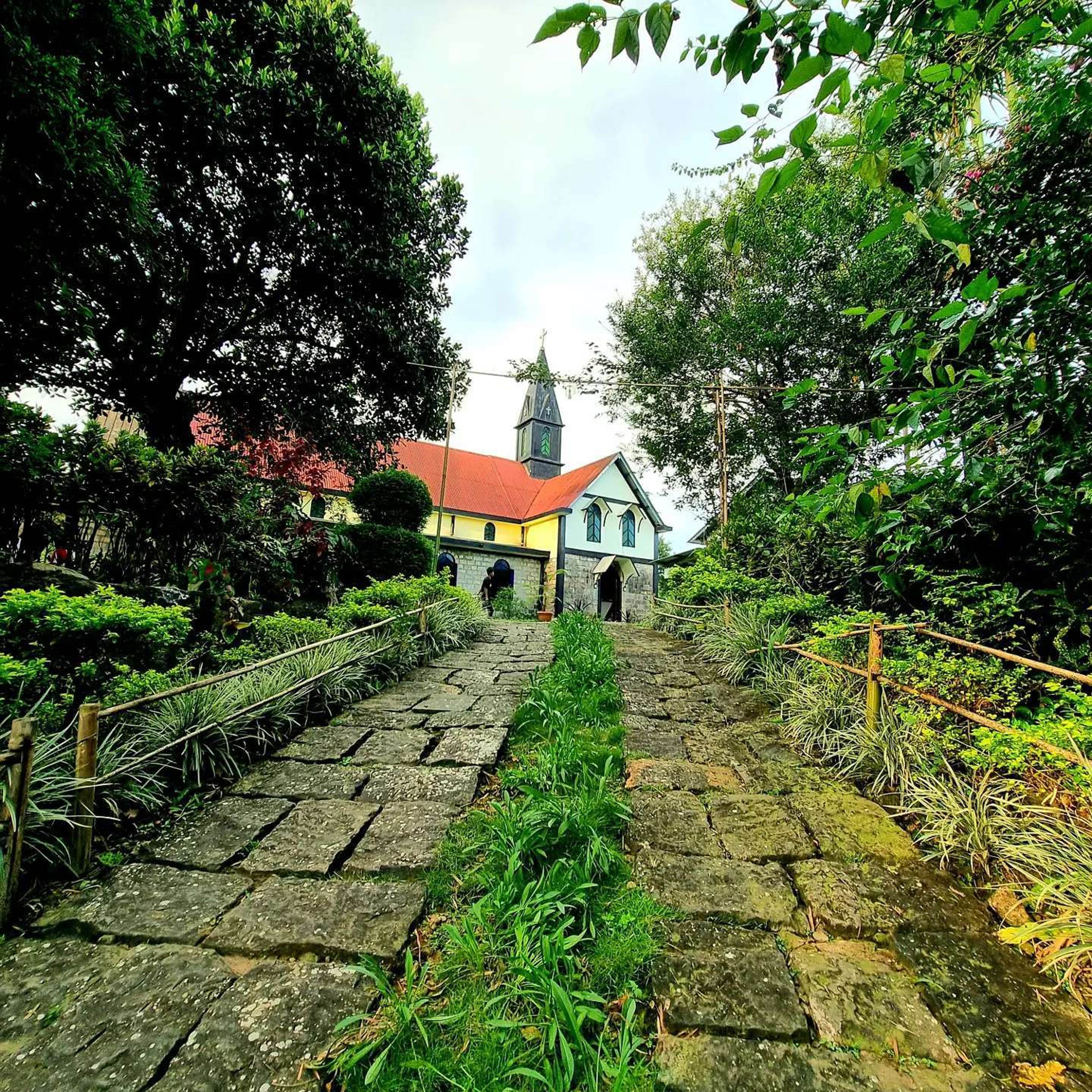 A stone path to the church in Mawlynnong