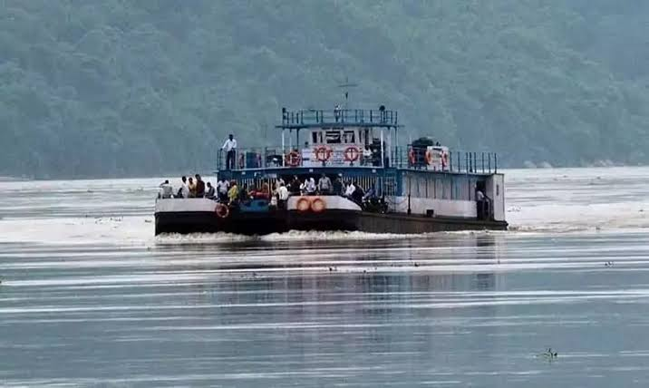 Passengers and vehicles on a ferry crossing the Brahmaputra river from Nimati Ghat to Majuli