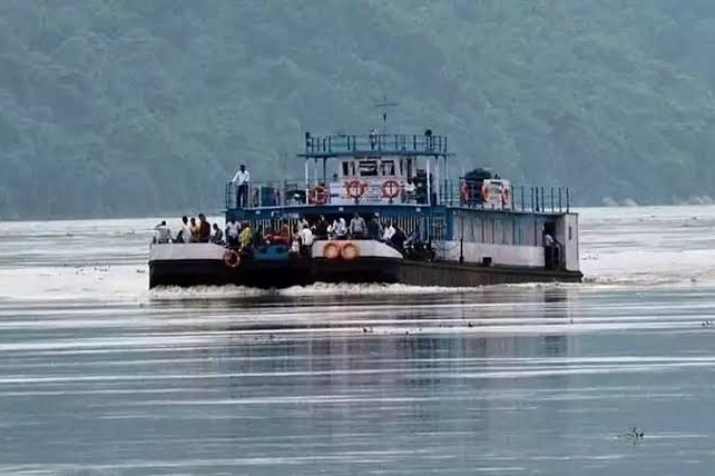 Passengers and vehicles on a ferry crossing the Brahmaputra river from Nimati Ghat to Majuli