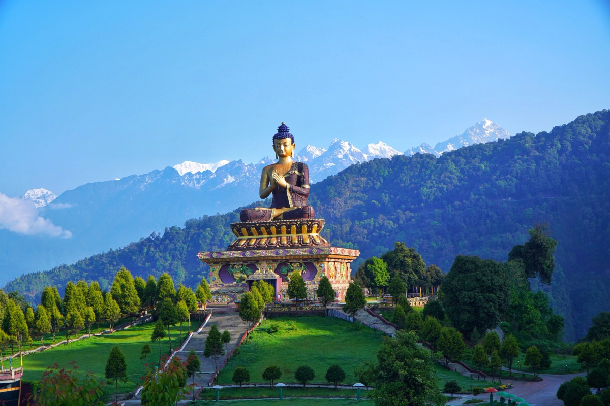 The golden Buddha statue in Ravangla, South Sikkim, surrounded by manicured gardens and clear mountain views.