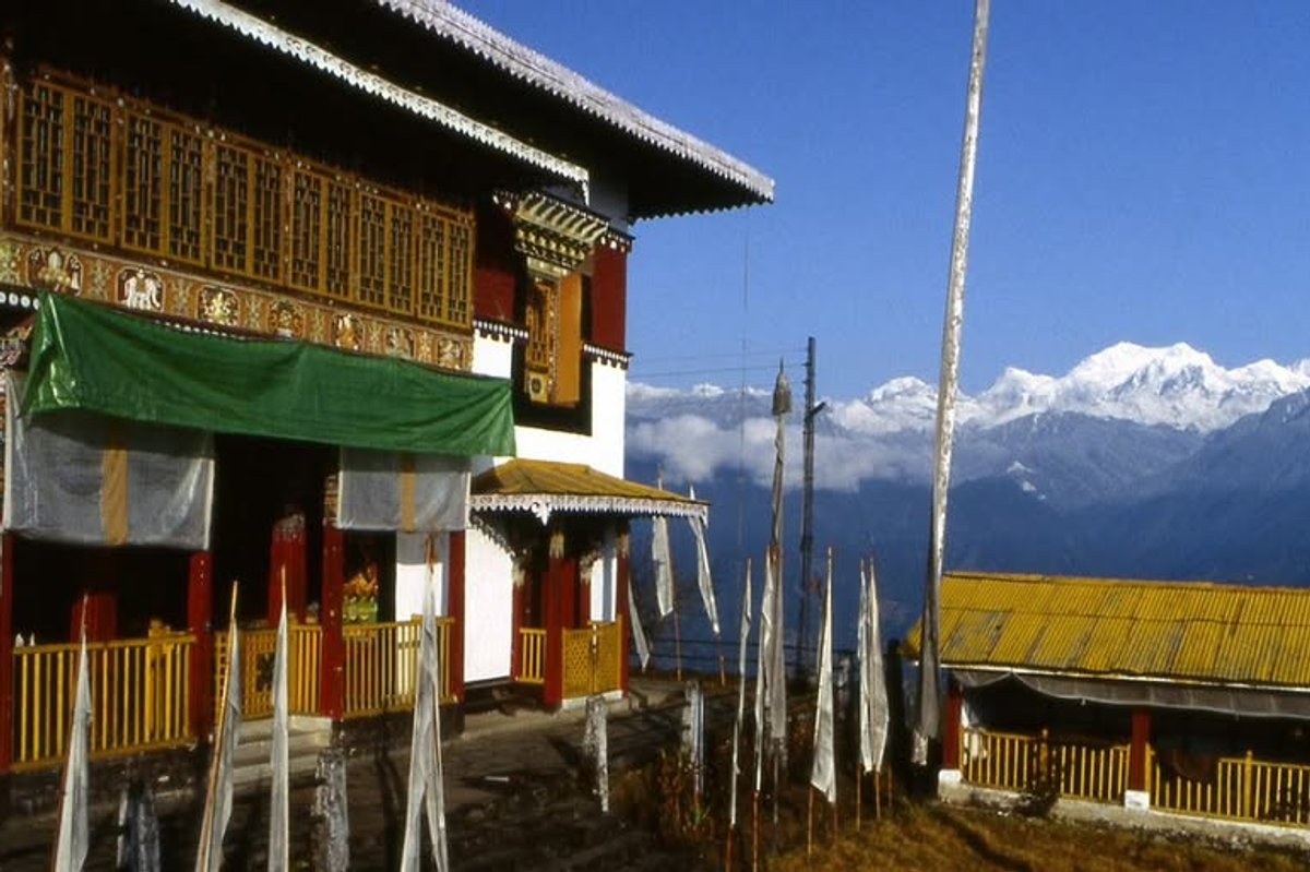 Pemayangtse Monastery in Pelling, West Sikkim, set against the towering, snow-covered peak of Mount Kanchenjunga.