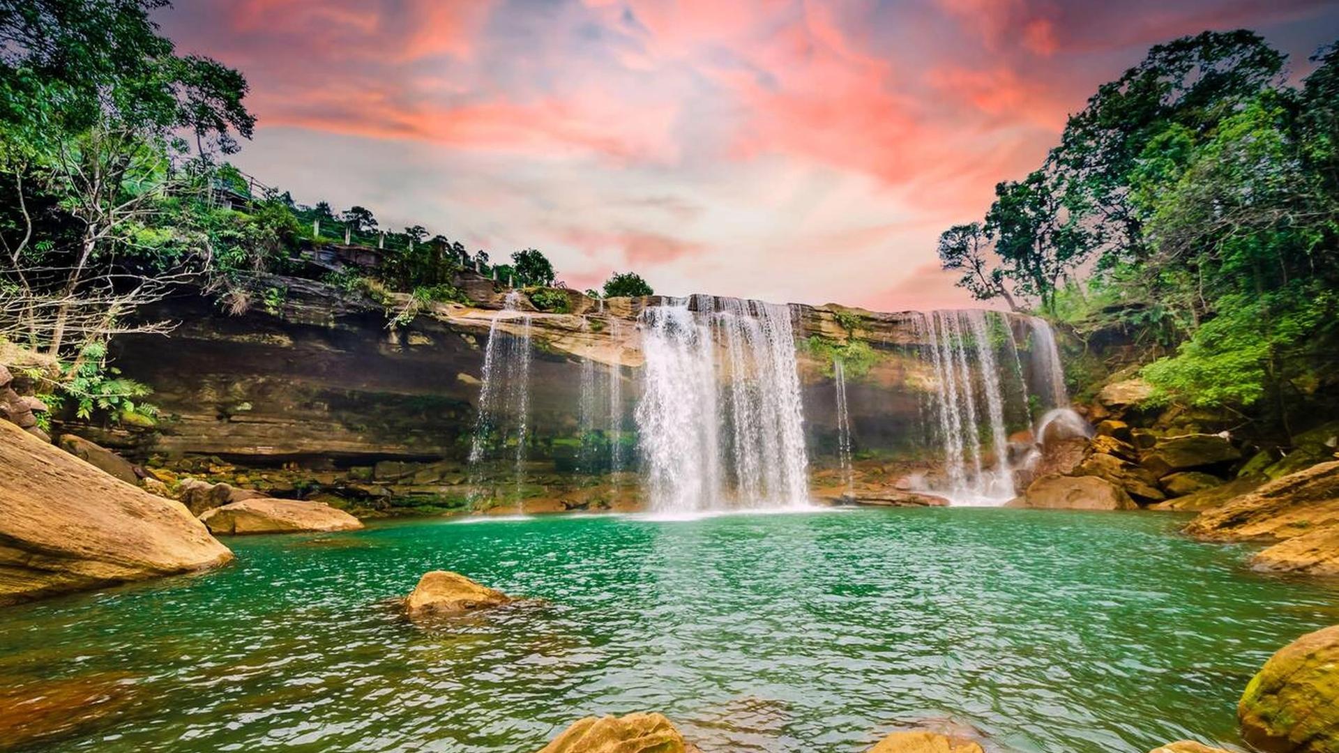 Beautiful waterfalls in Meghalaya flowing through lush green hills and misty valleys in Northeast India