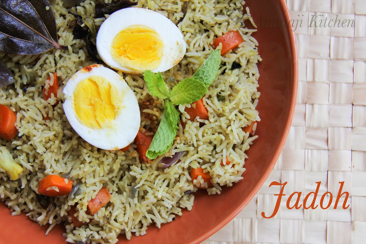 A steaming plate of Jadoh — traditional Khasi rice slow-cooked with meat and served at a riverside stall in Dawki