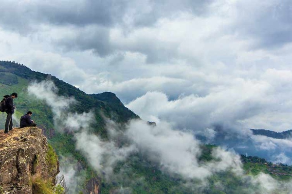 Trekking in Meghalaya with lush green hills and misty landscapes
