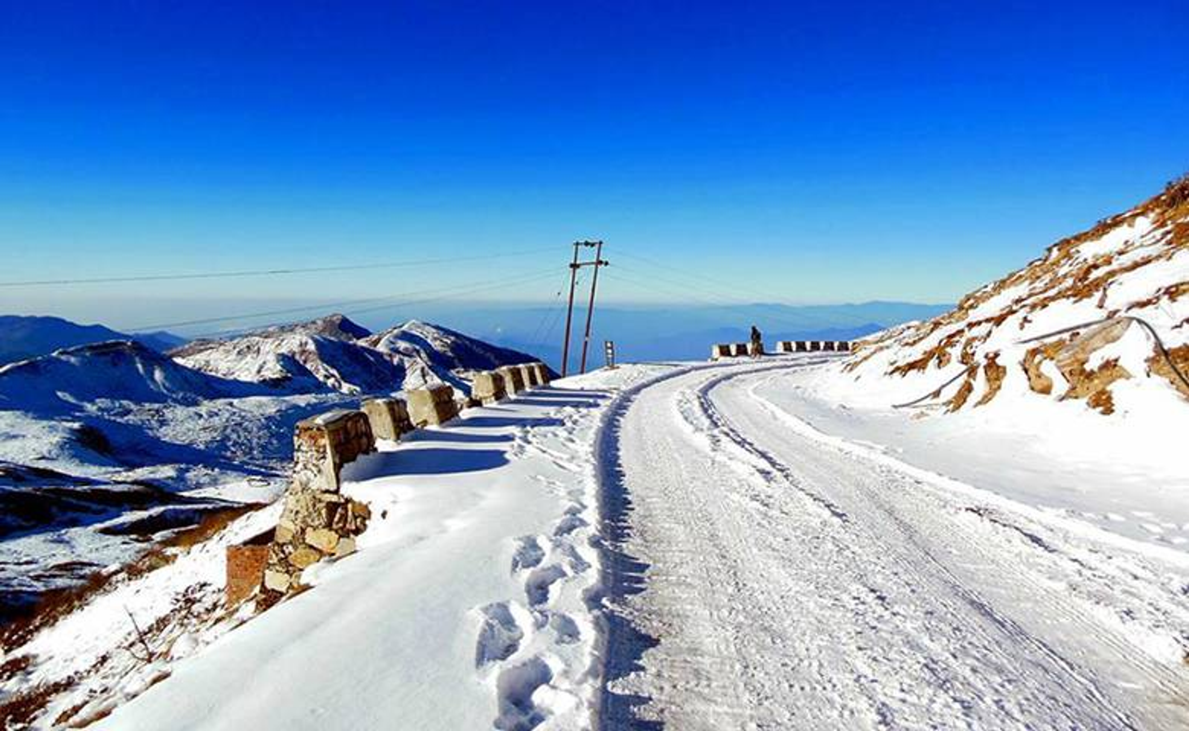 High-altitude Nathang Valley on the Old Silk Route completely covered in deep pristine white snow during the best time for snowfall in Sikkim.
