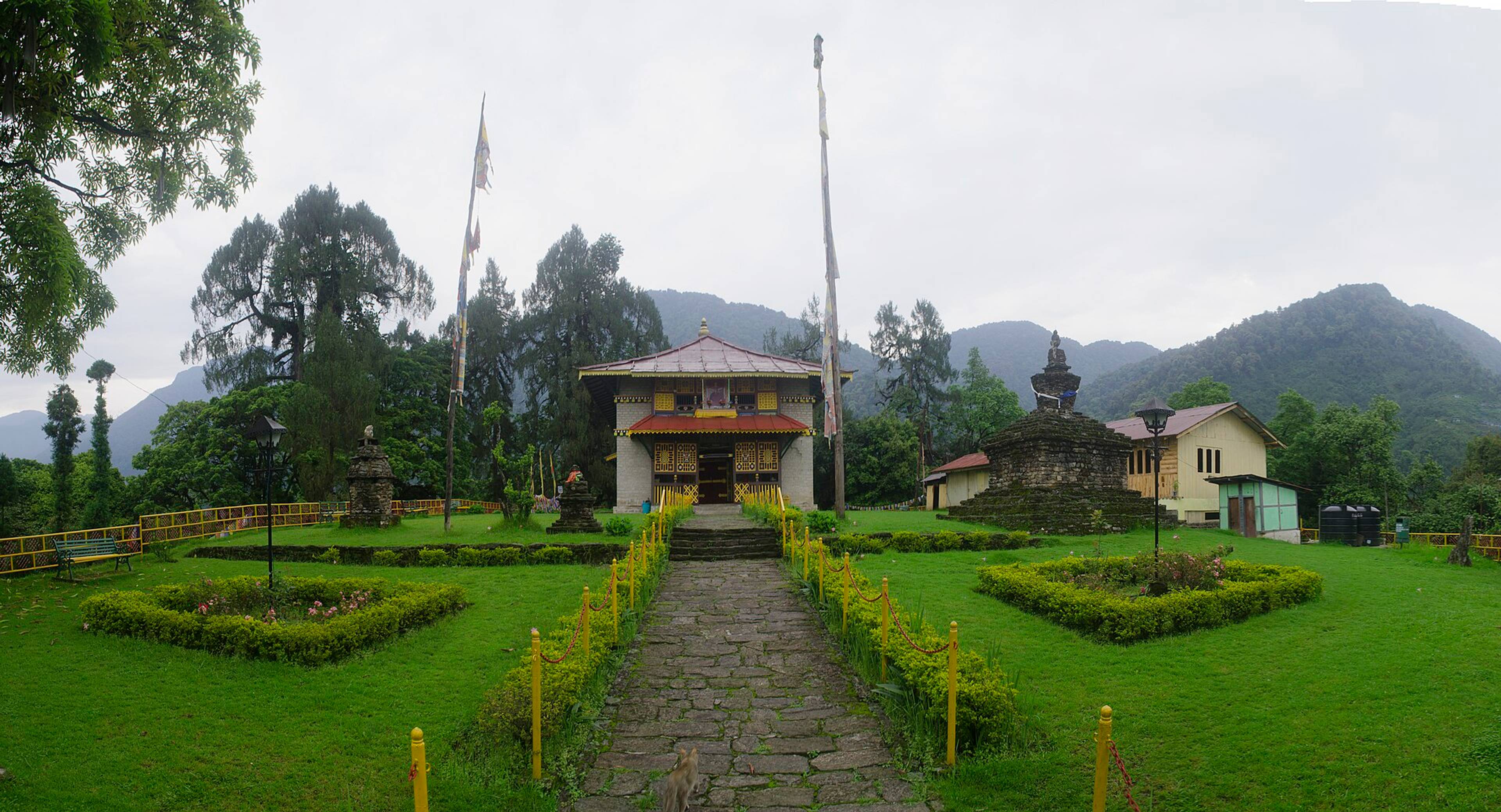 Dubdi Monastery among prayer flags and forest above Yuksom, Sikkim