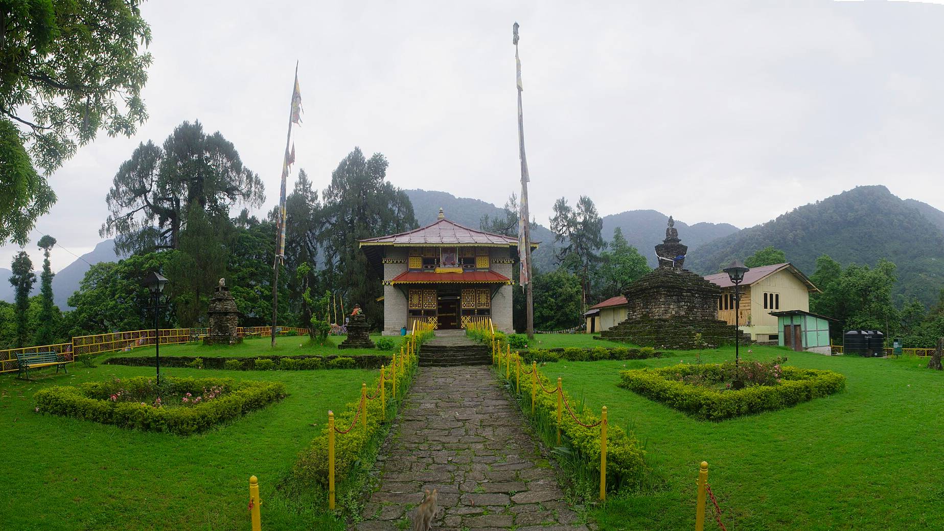 Dubdi Monastery among prayer flags and forest above Yuksom, Sikkim