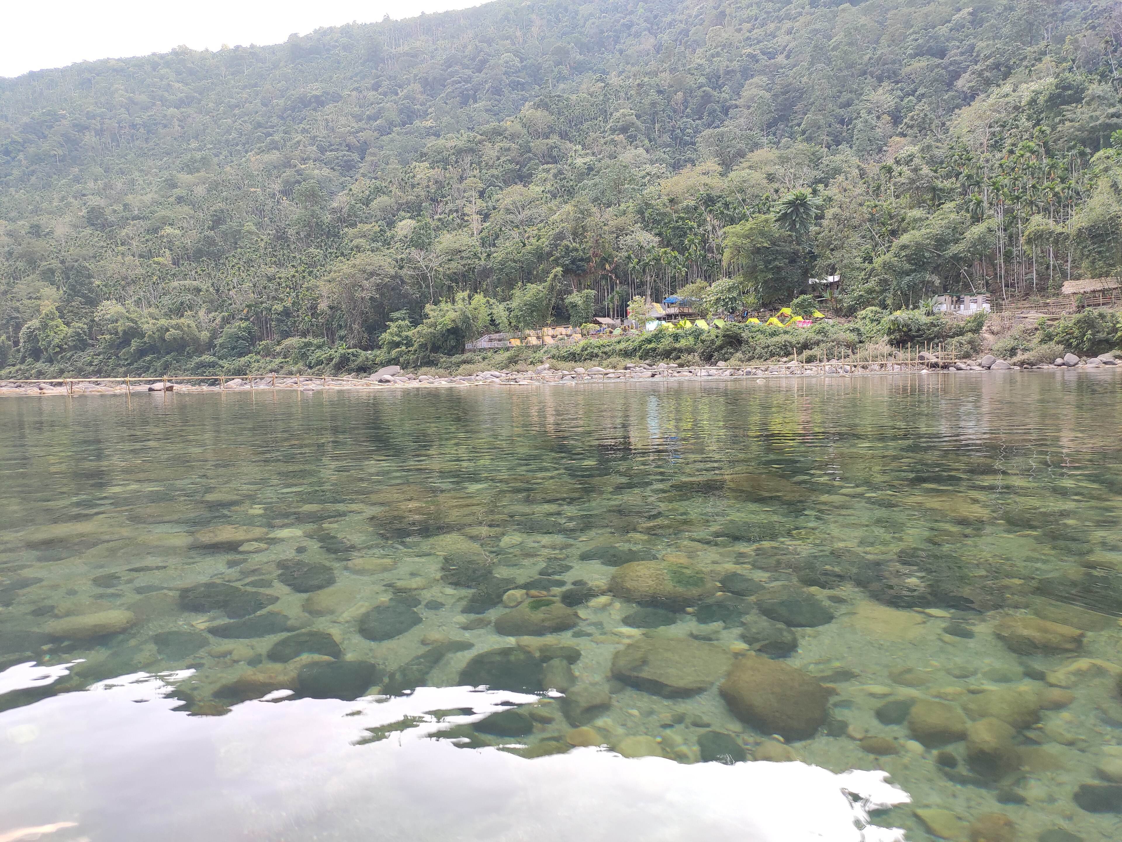 Pebbles visible through the shallow, clear water of the Umngot