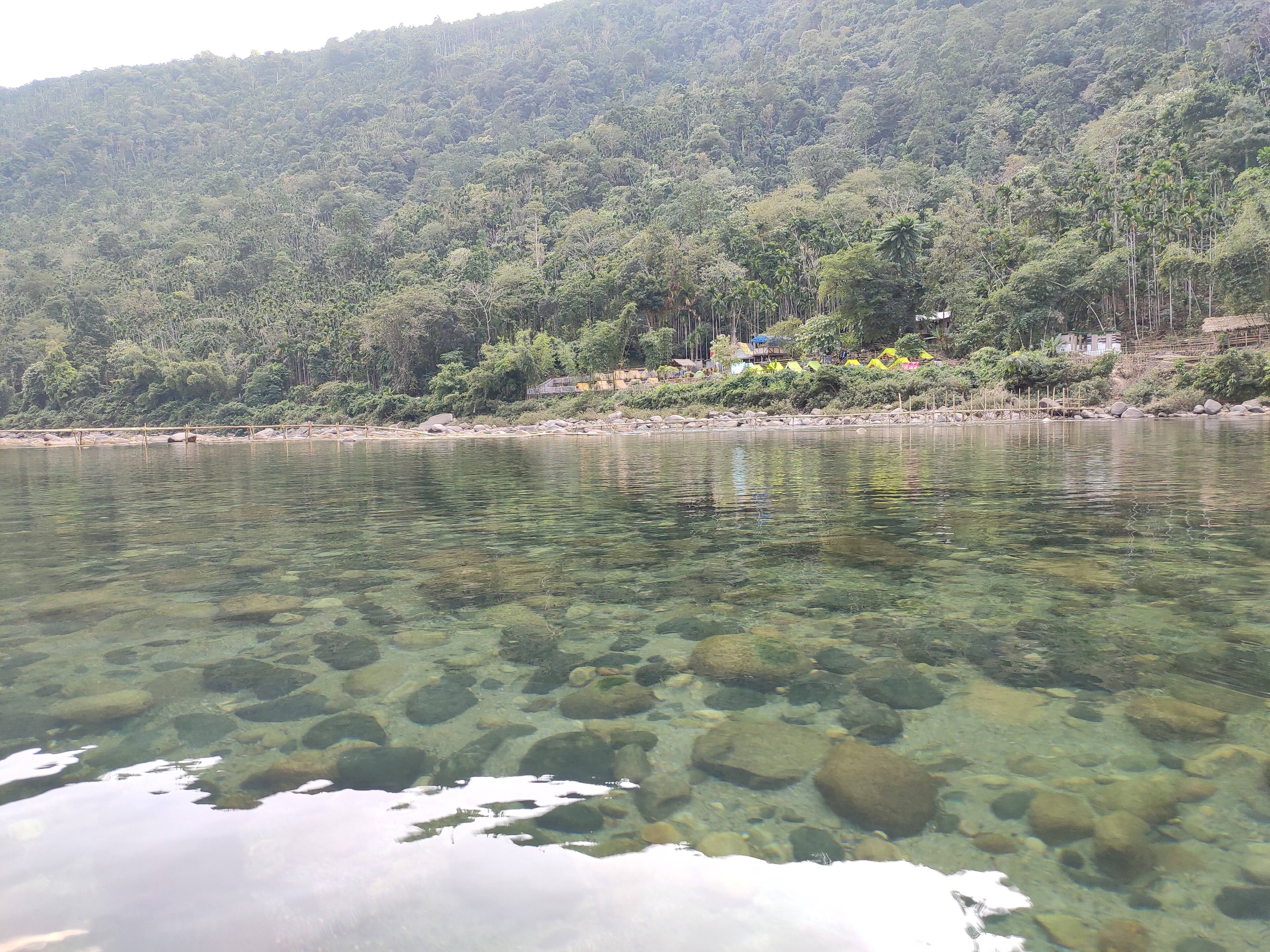 Pebbles visible through the shallow, clear water of the Umngot
