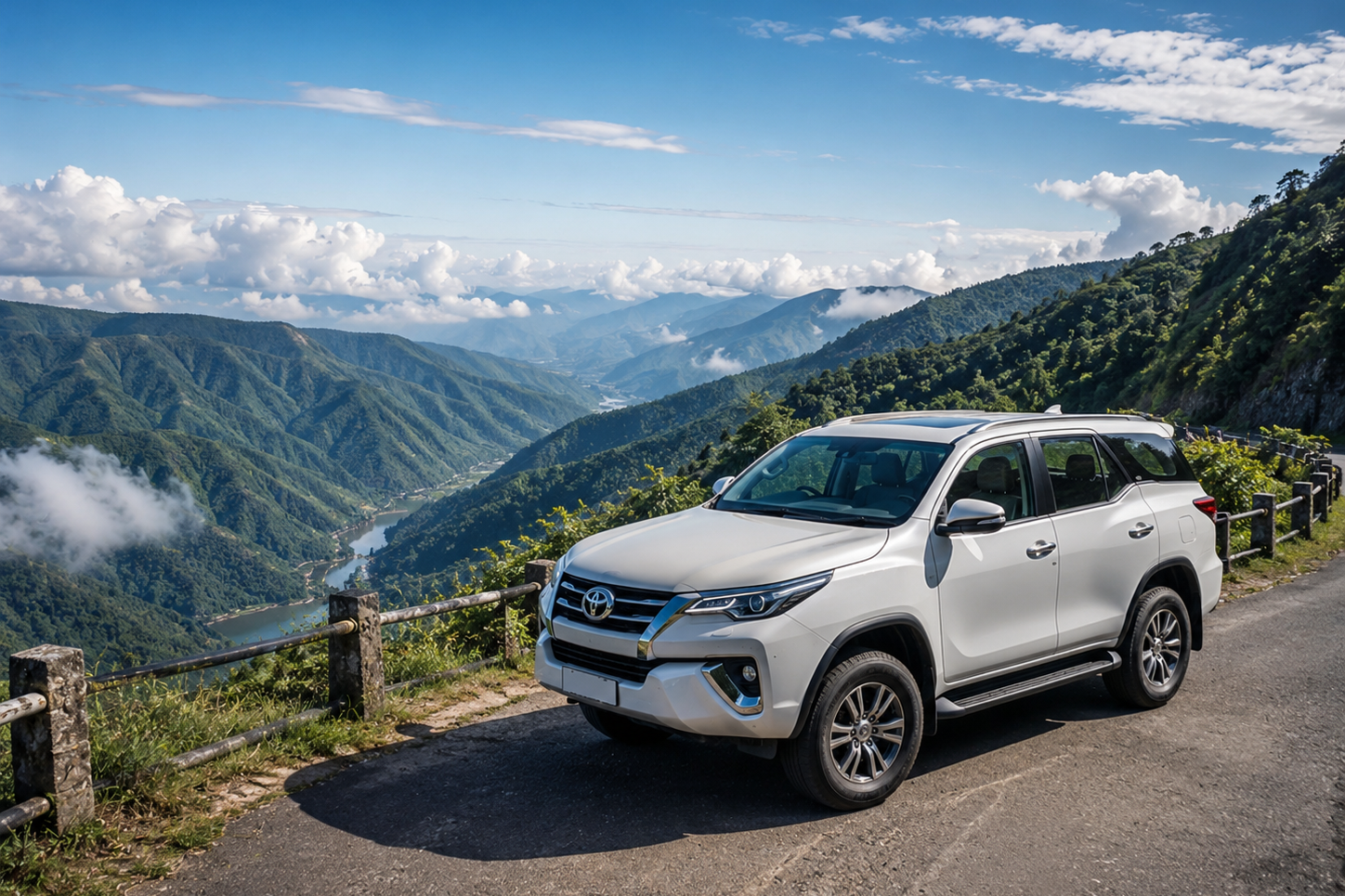 A luxury white SUV vehicle parked safely at a panoramic mountain road overlook in the Khasi Hills of Meghalaya."