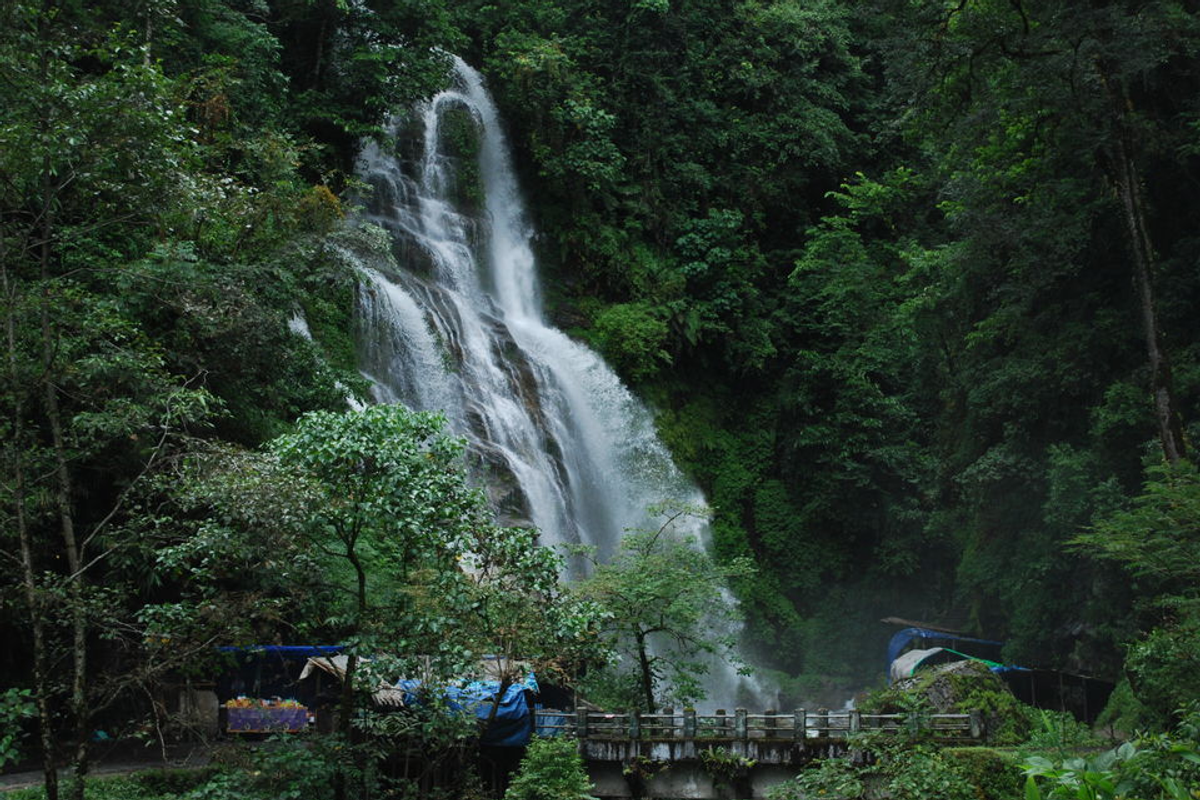 Powerful Kanchenjunga Falls in West Sikkim at peak flow during the lush monsoon rainy season in August.