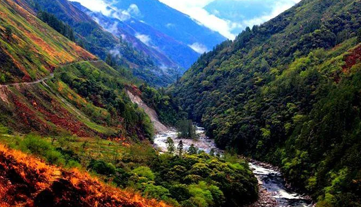 Mountain valley with river and misty slopes in Arunachal Pradesh, highlighting Mechuka and nearby destinations