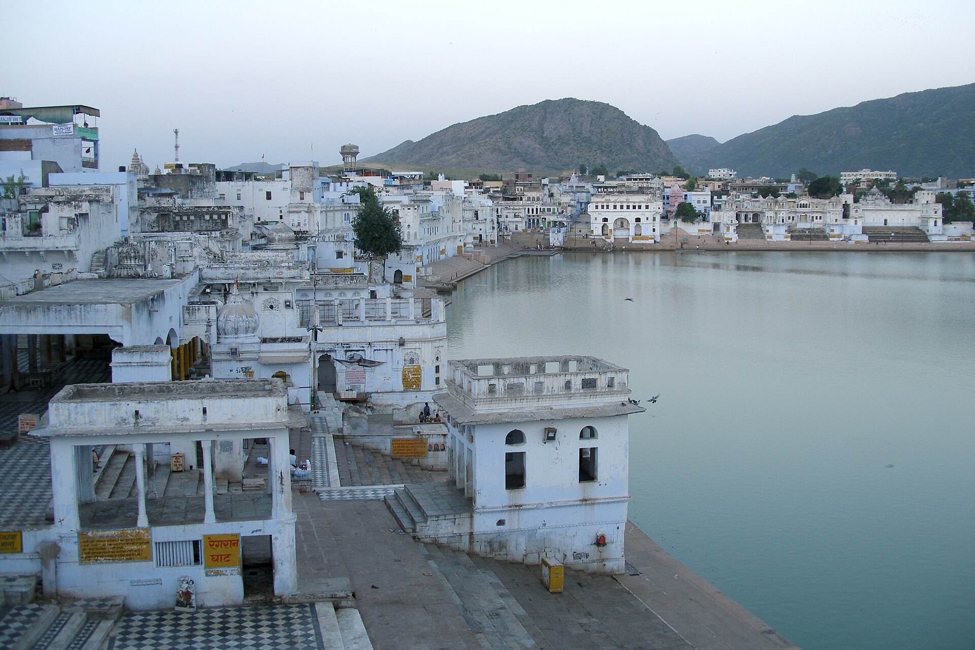 Pushkar Lake and its white ghats at twilight