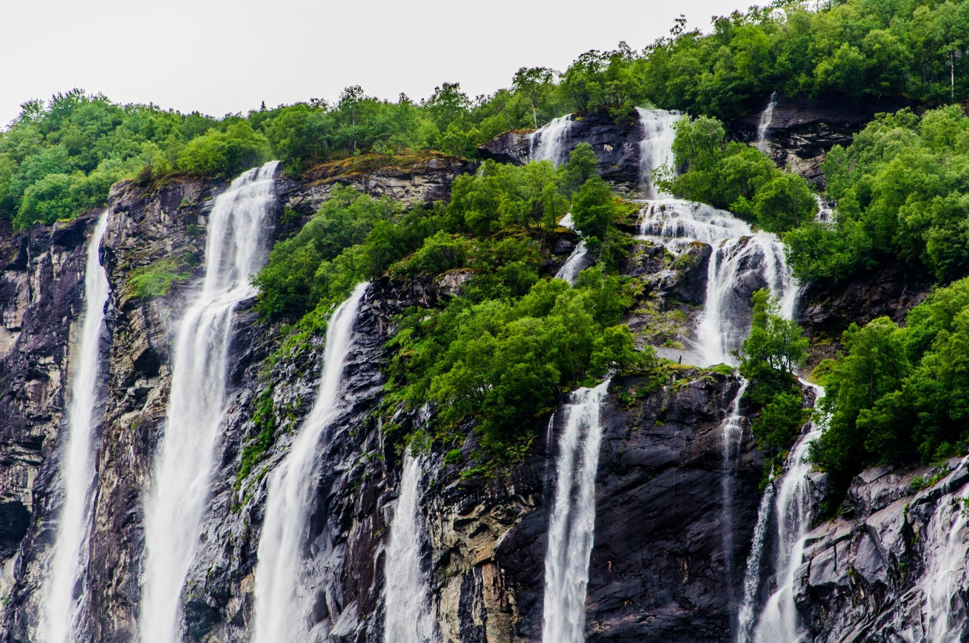 Seven Sisters Waterfall in Cherrapunji Meghalaya, also known as Nohsngithiang Falls, showing seven parallel streams plunging 315 meters from a limestone cliff.