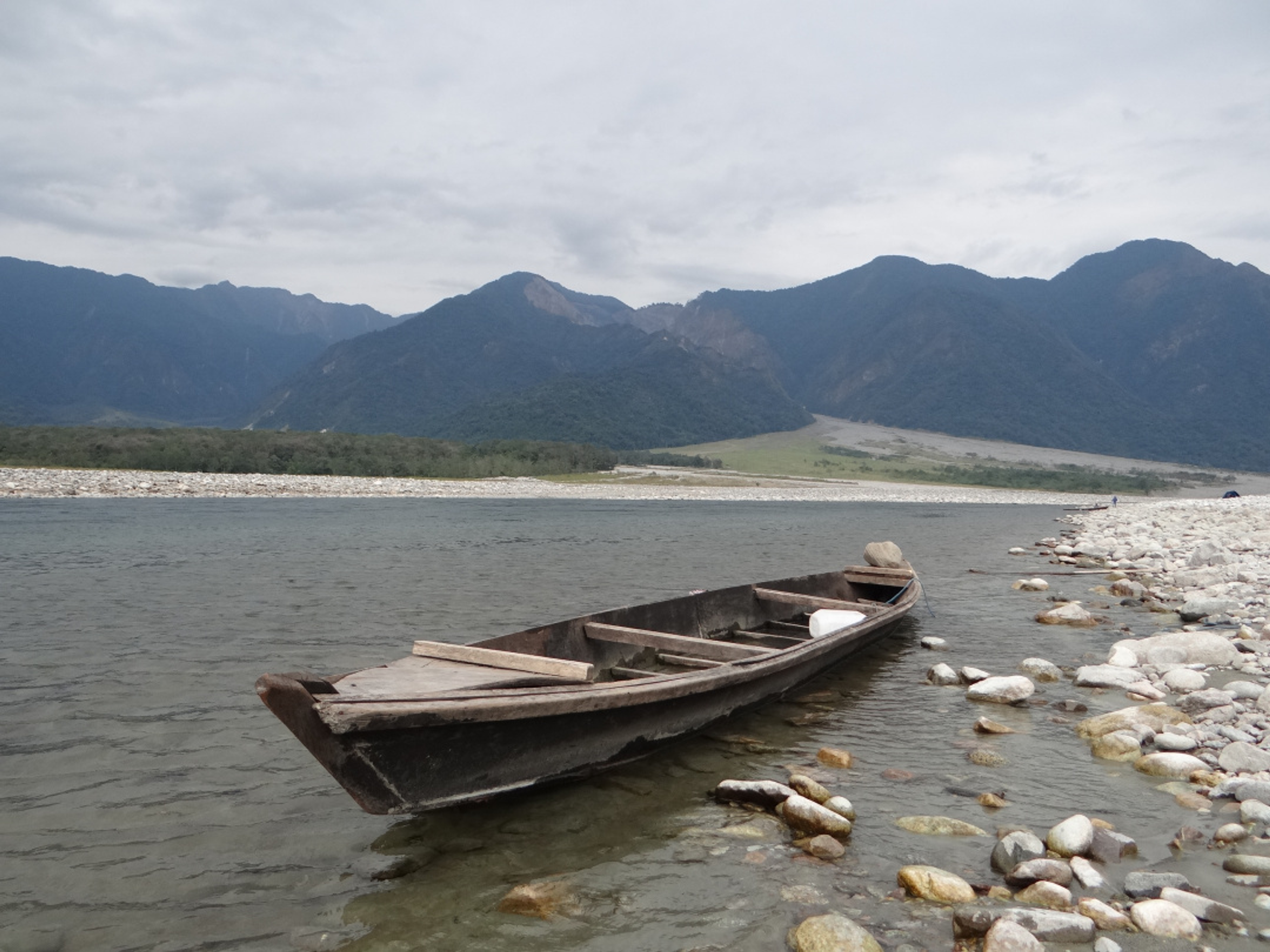 Turquoise waters of the Dibang River flowing past massive white boulders at Nizamghat.