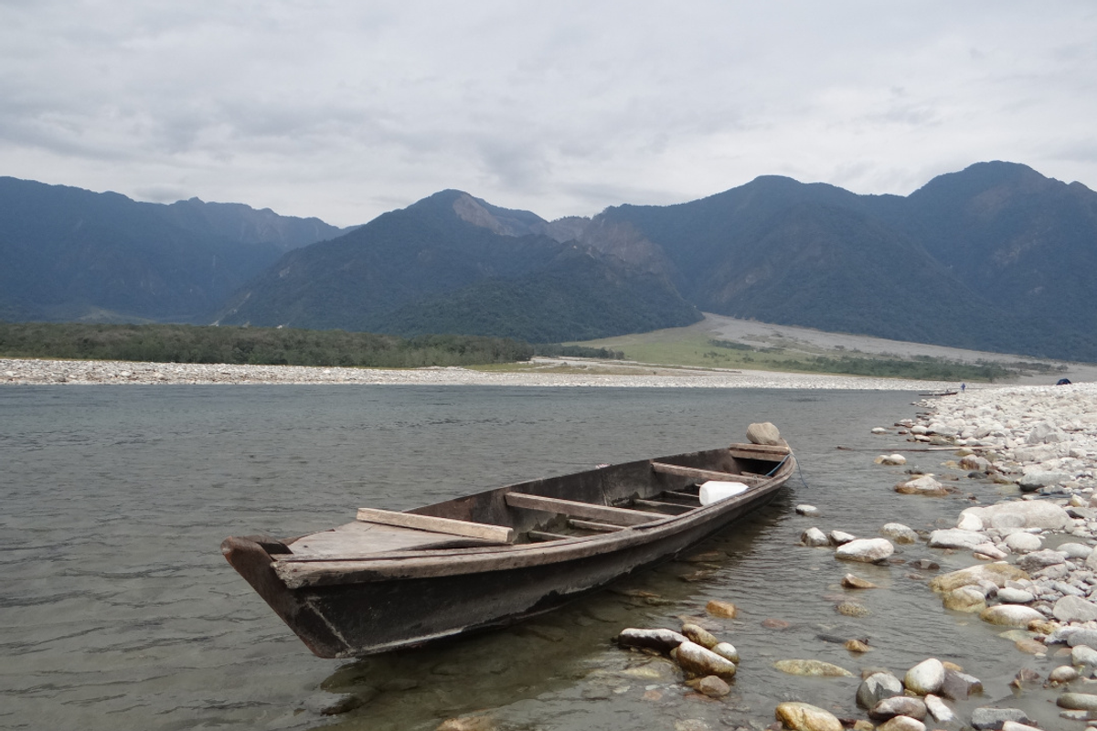 Turquoise waters of the Dibang River flowing past massive white boulders at Nizamghat.