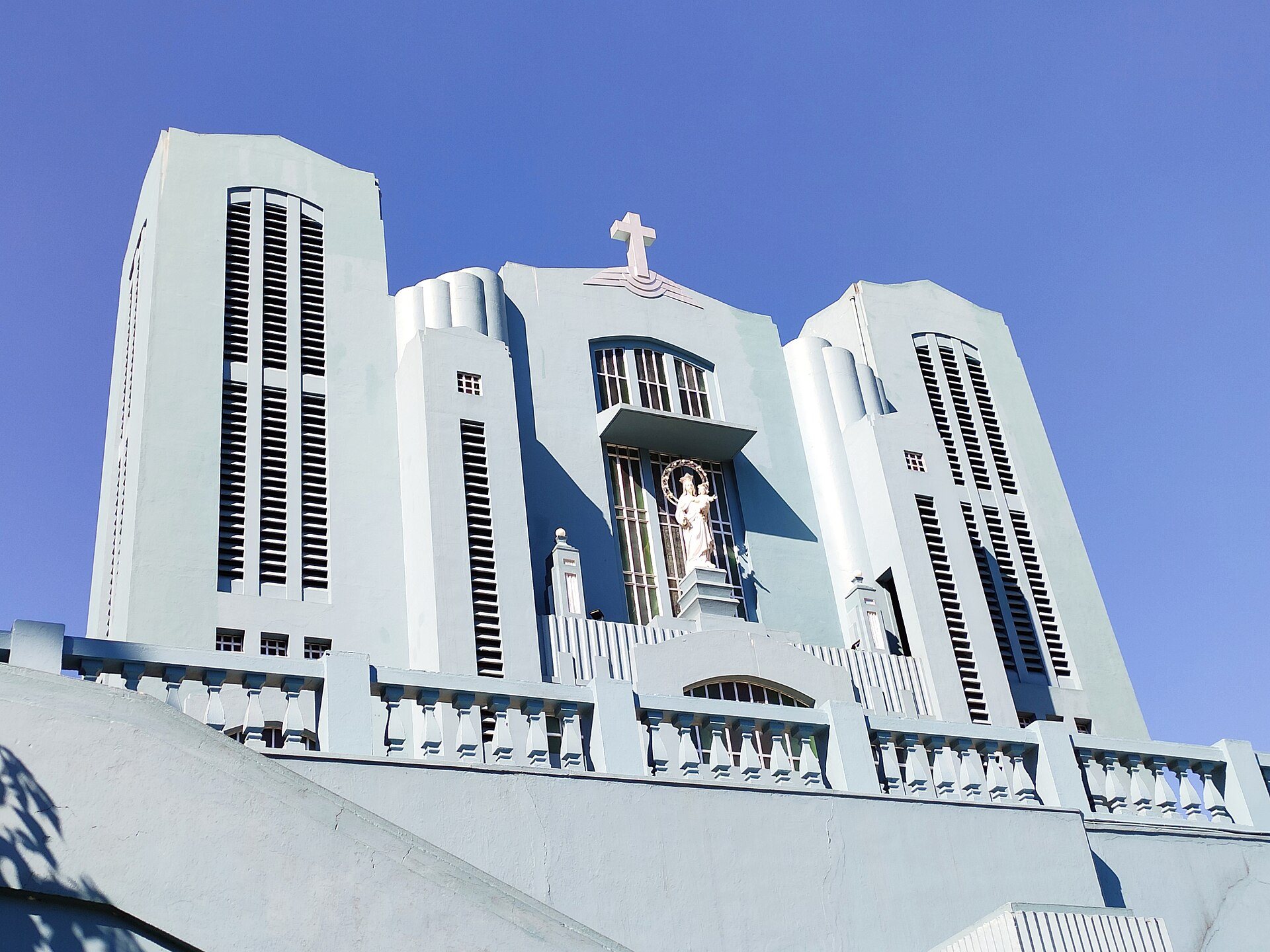 The pale blue Cathedral of Mary Help of Christians in Laitumkhrah, Shillong, on a clear winter day