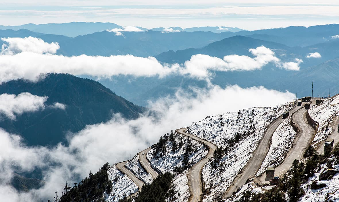 The winding mountain roads of Sela Pass leading toward Tawang, Arunachal Pradesh.