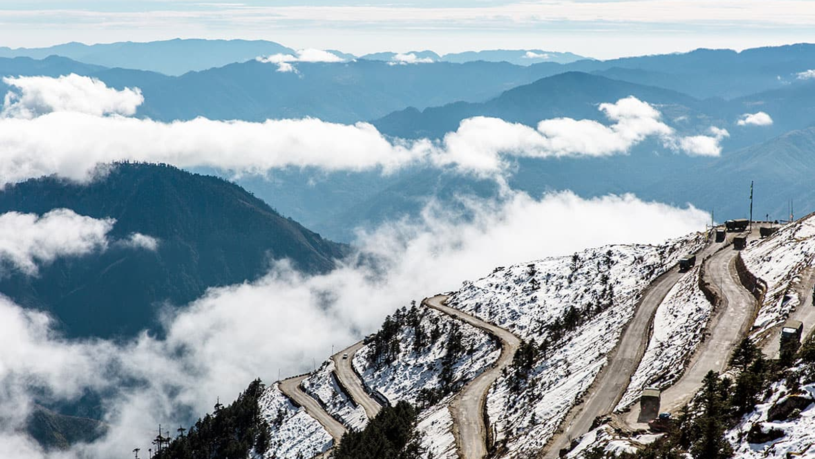 The winding mountain roads of Sela Pass leading toward Tawang, Arunachal Pradesh.