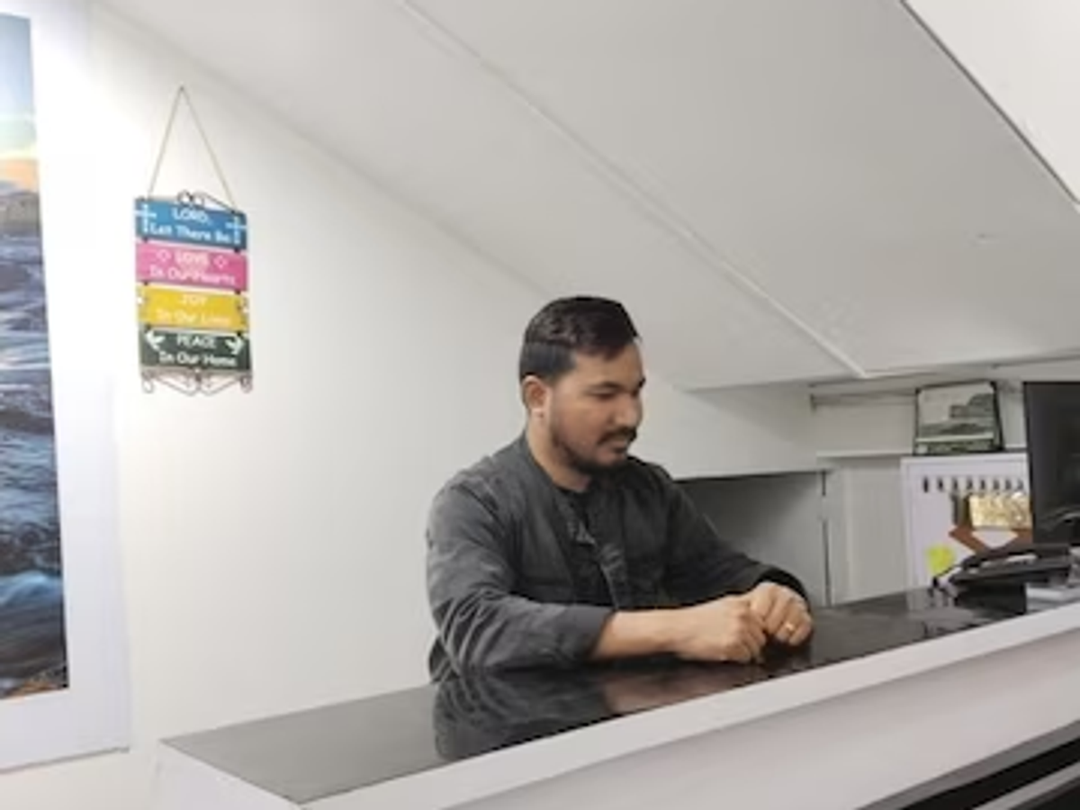 Guest checking in at a homestay reception in Meghalaya