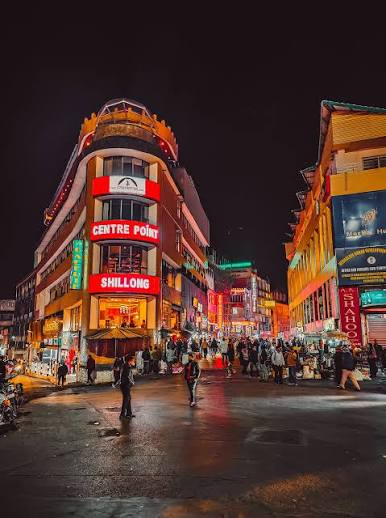 Evening street view of Police Bazar in Shillong with shops and lights