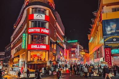 Evening street view of Police Bazar in Shillong with shops and lights