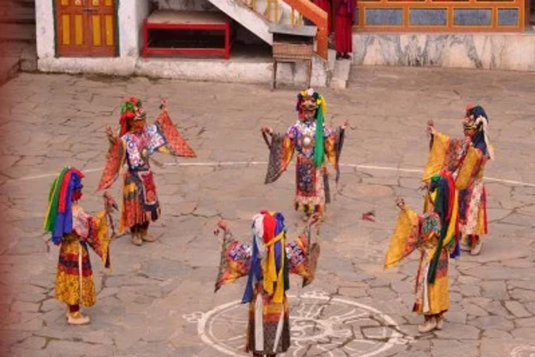 Monks and dancers in traditional Monpa costume at Tawang Monastery