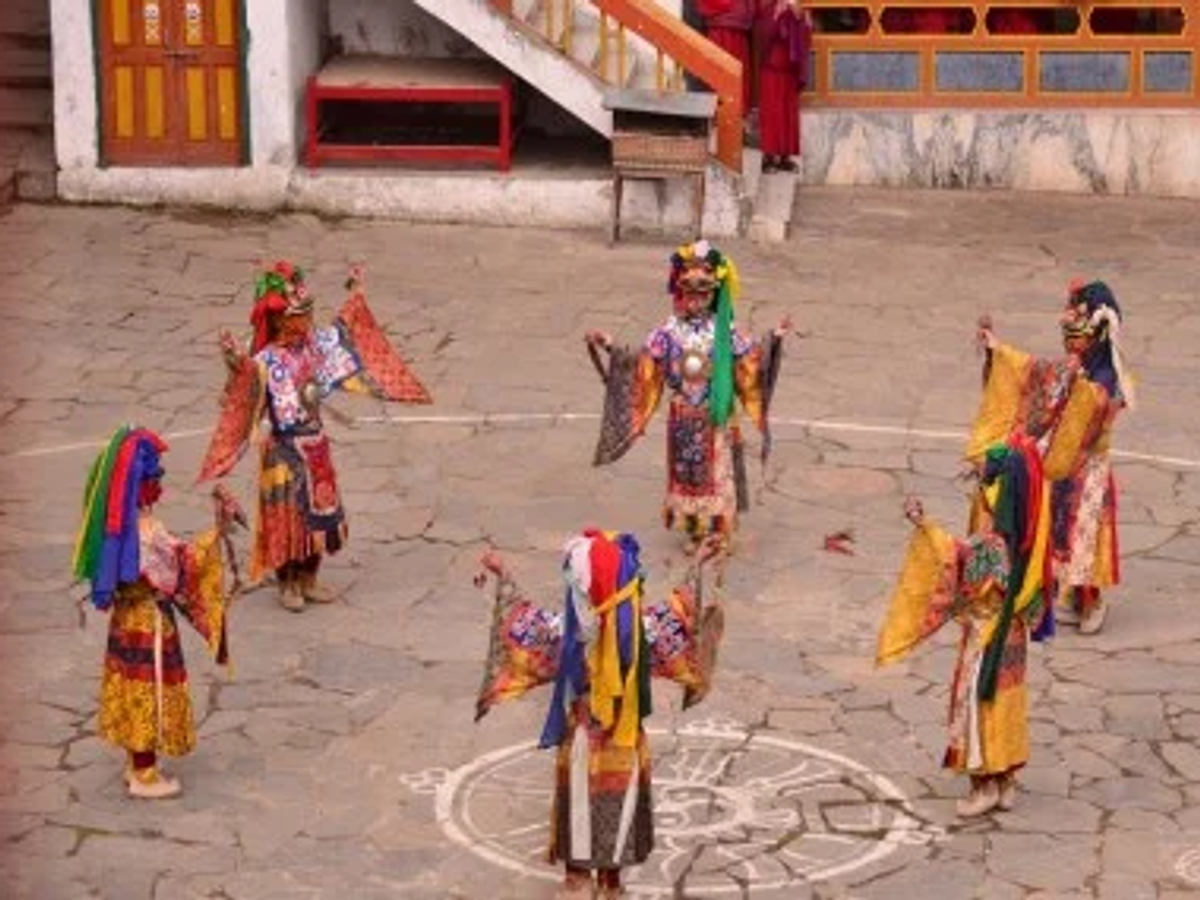 Monks and dancers in traditional Monpa costume at Tawang Monastery
