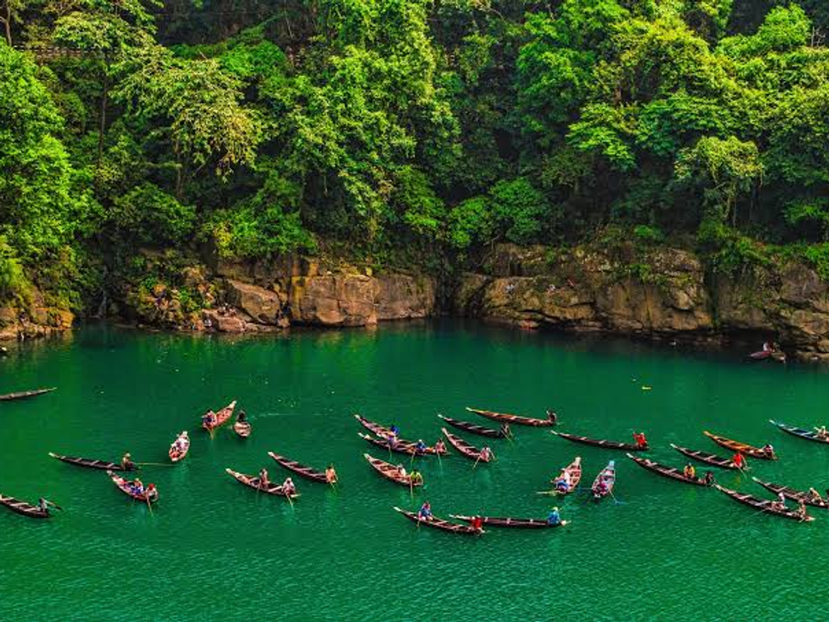 Visitors on boats on the clear Umngot river at Dawki, Meghalaya