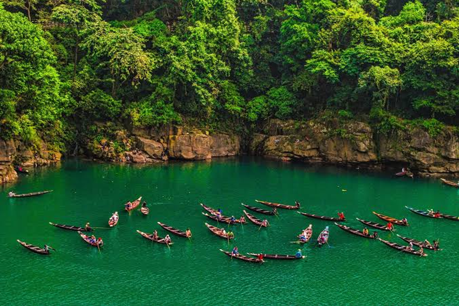 Visitors on boats on the clear Umngot river at Dawki, Meghalaya