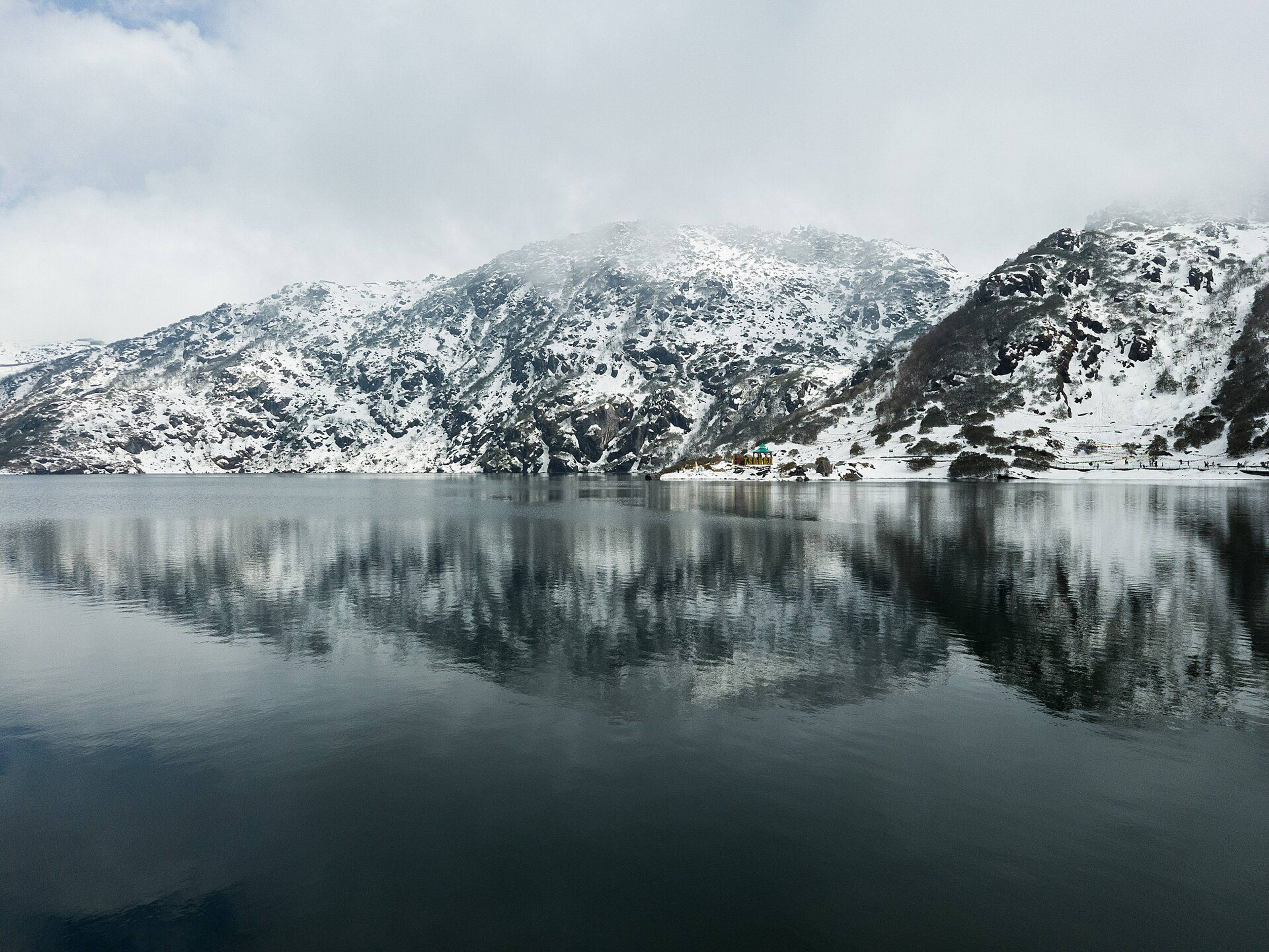 Tsomgo Lake below bare mountain slopes in East Sikkim