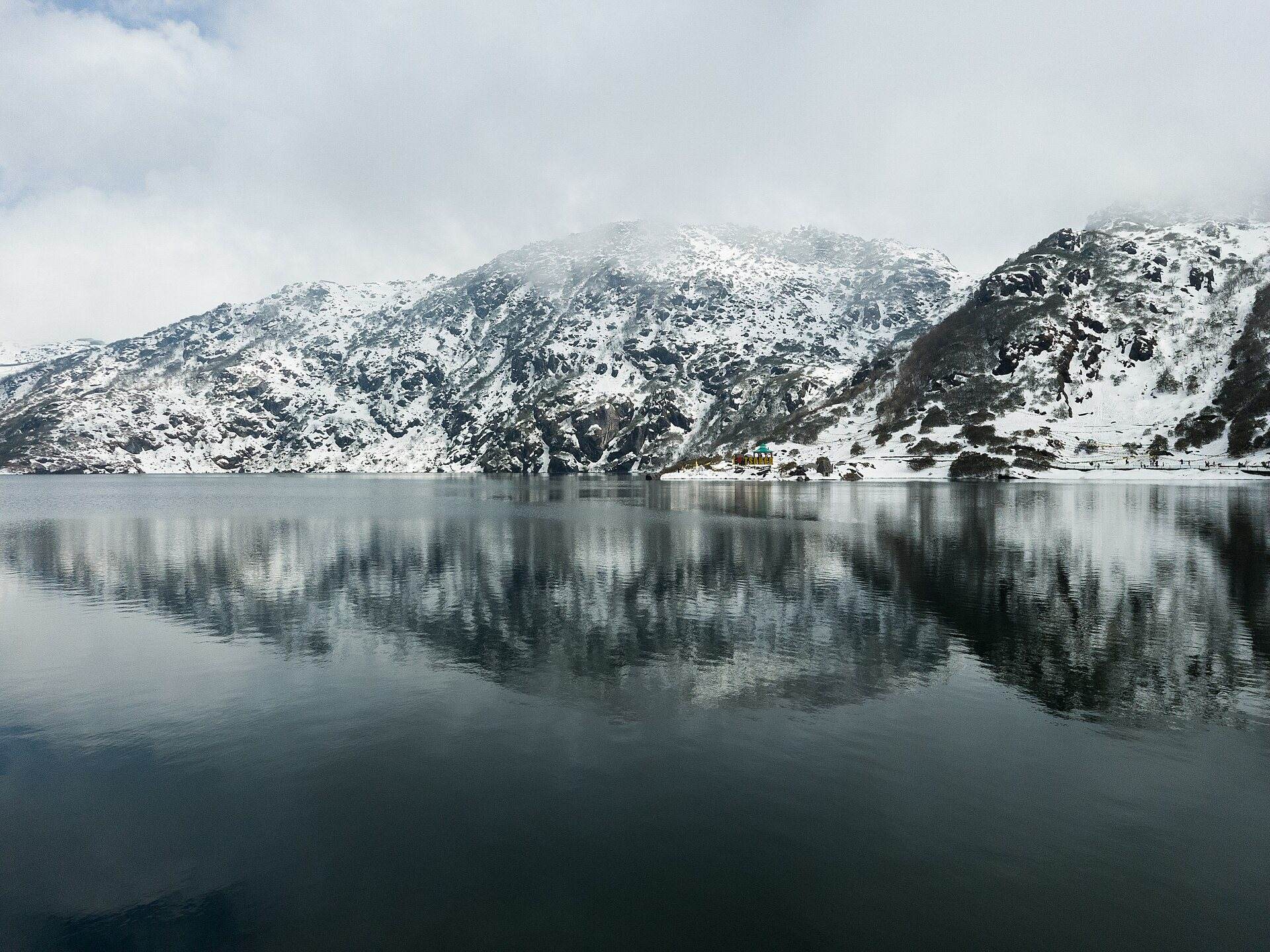 Tsomgo Lake below snow-covered ridges, East Sikkim