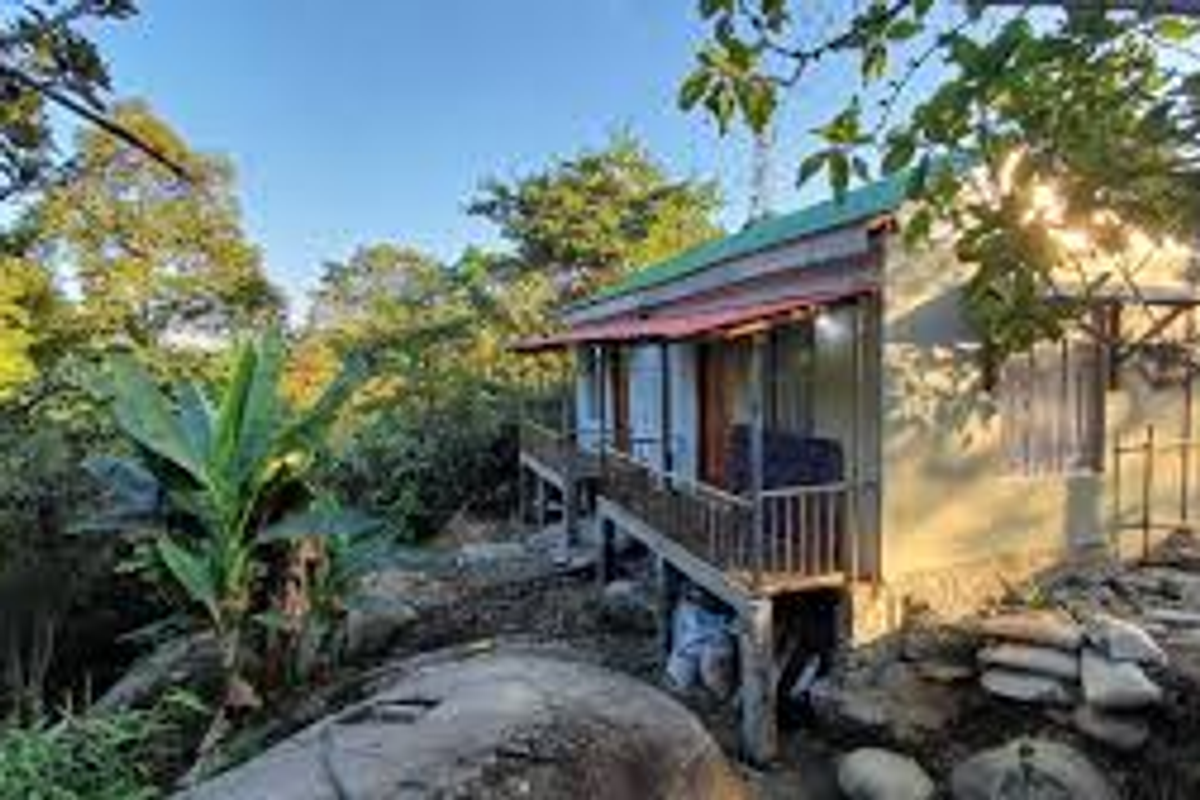 Bamboo architecture at Langkylling Homestay in Mawlynnong.]