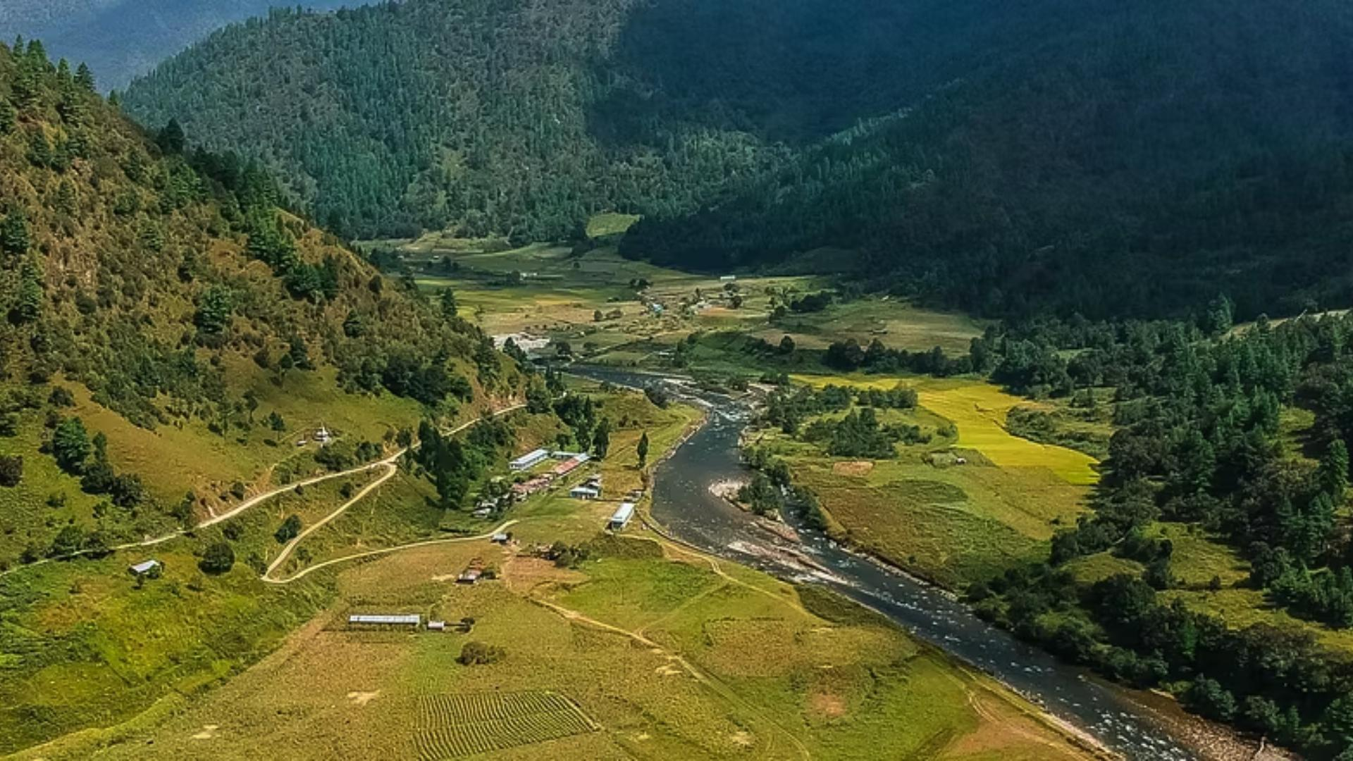 Lush green mountains valley and winding river in Arunachal Pradesh.