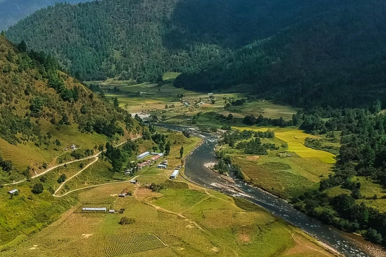 Lush green mountains valley and winding river in Arunachal Pradesh.