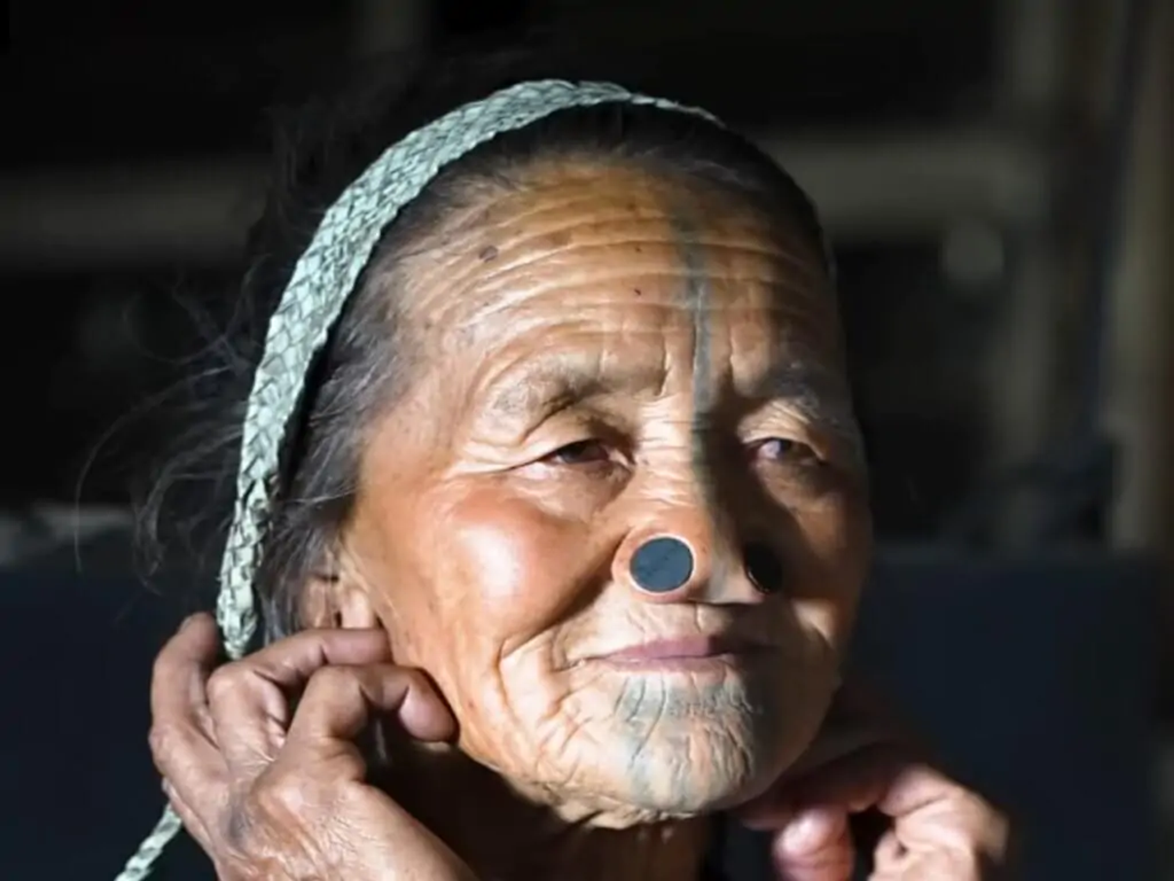 Portrait of an Apatani elder showcasing the unique cultural heritage of Ziro Valley.]