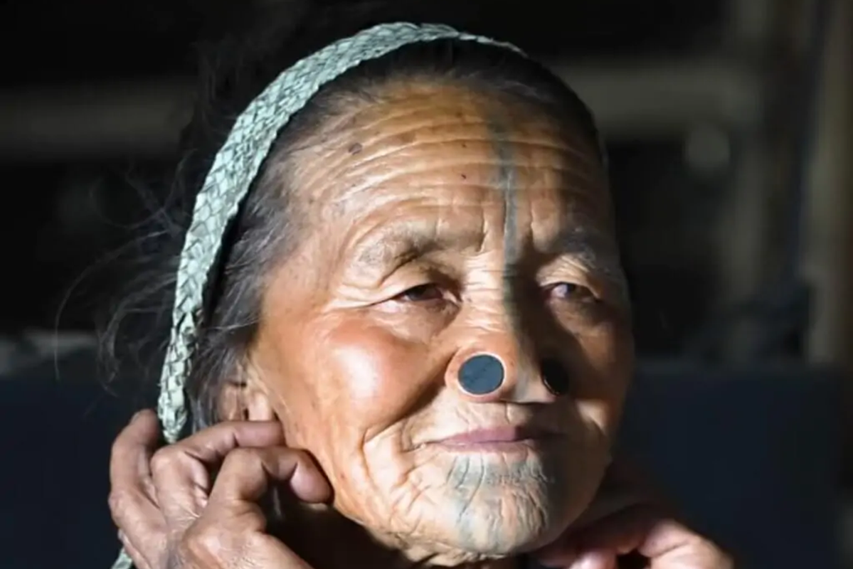 Portrait of an Apatani elder showcasing the unique cultural heritage of Ziro Valley.]